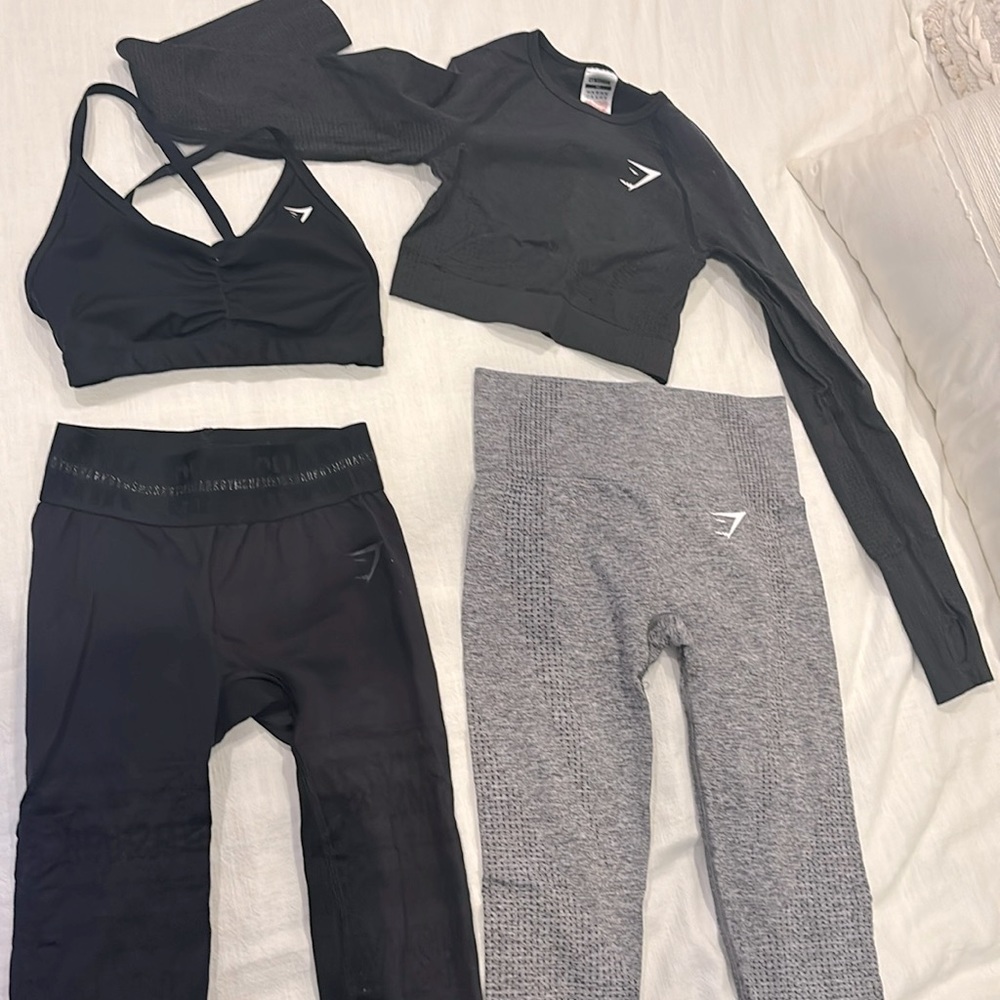 Black and grey gymshark bundle. 2 workout tops, 2 leggings